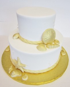 Nautical beach wedding cake in white and gold
