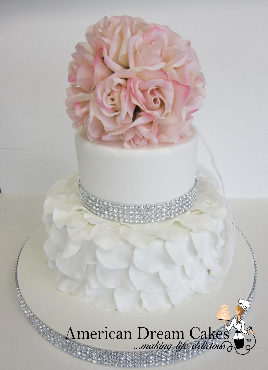 Romantic white wedding cake with petals ruffles