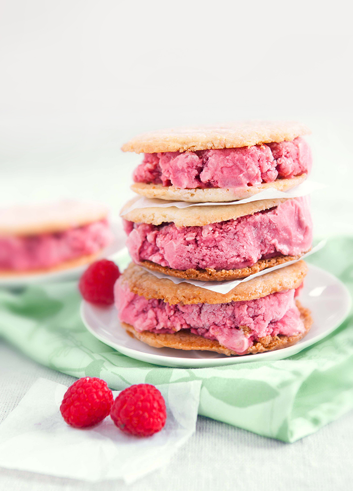 Close up image of a stack of home mad raspberry saandwich on table