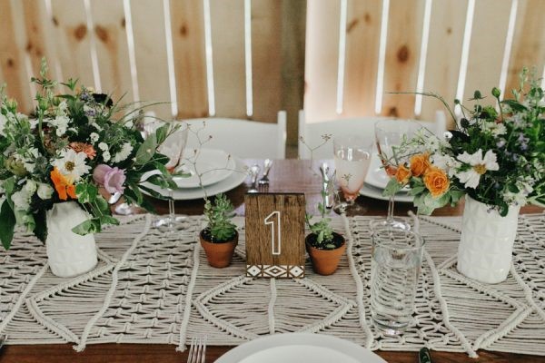 Boho wedding table setting with Bohemian flower arrangements aand succulent plants